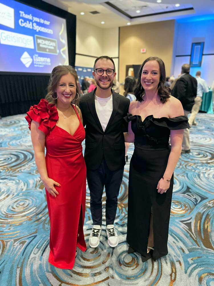 Bill and two female guests at gala